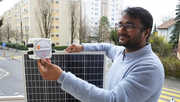 SmartHelio founder with a prototype of the IoT sensor